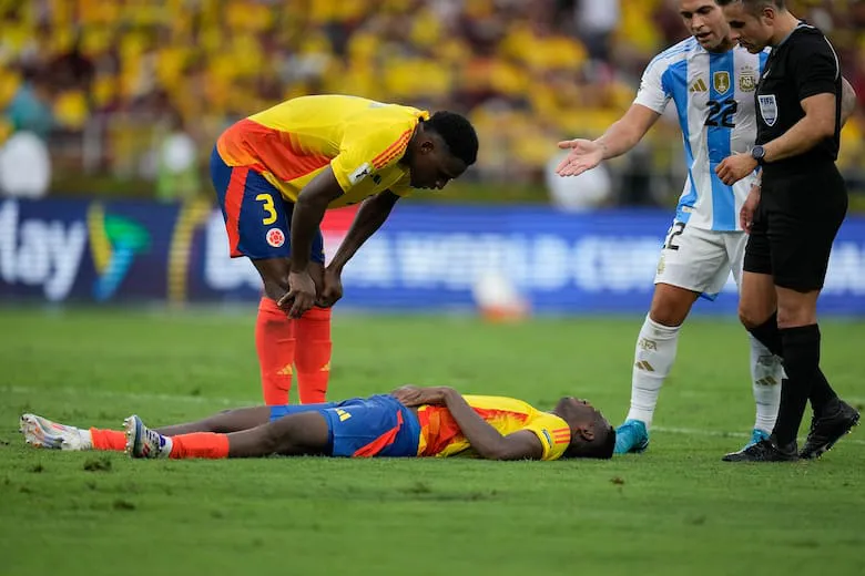 colombias-yerson-mosquera-lies-on-the-grass-MEC6R2KAANFQBBUWK43IVYR3TM